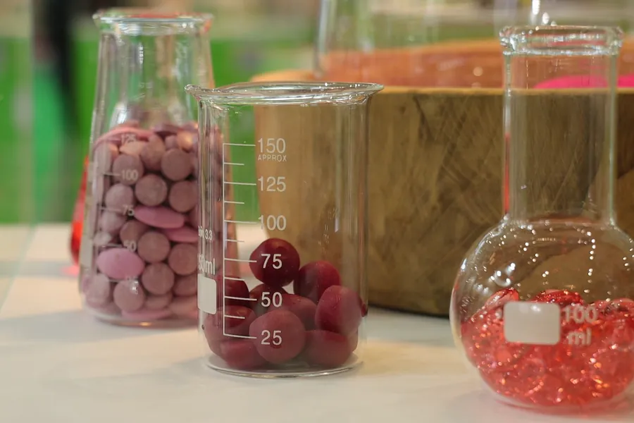 Glass laboratory jars filled with nutraceutical supplements